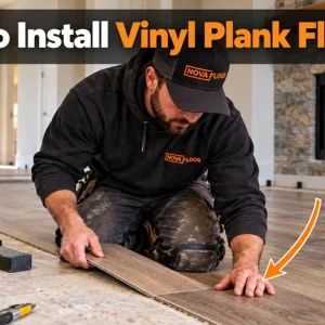 Nova Floor installer clicking a vinyl plank into place during installation