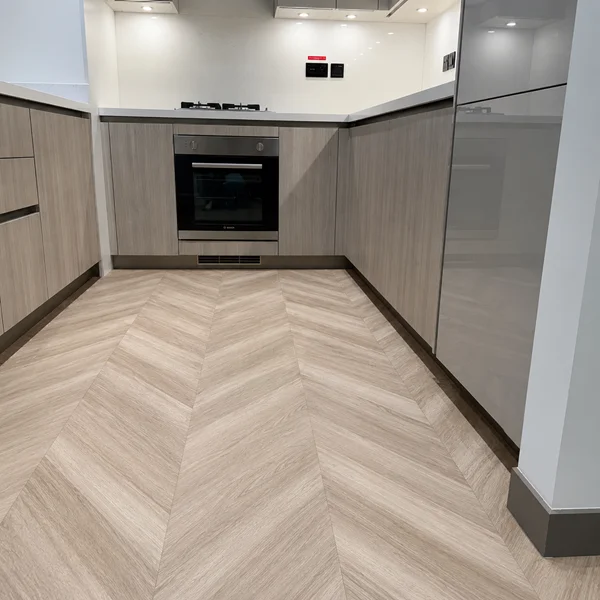 chevron flooring installation in kitchen at Sobha Hartland, Dubai
