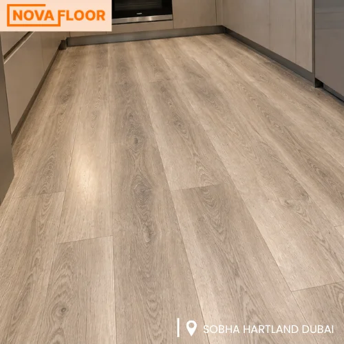 The finished living and dining area, with light oak LVT planks running from the lounge through to the dining space