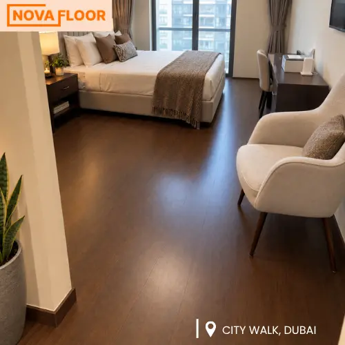 Warm walnut brown SPC flooring installed in a Dubai apartment bedroom