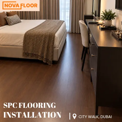 closer view of SPC flooring installation with warm walnut brown planks in Dubai